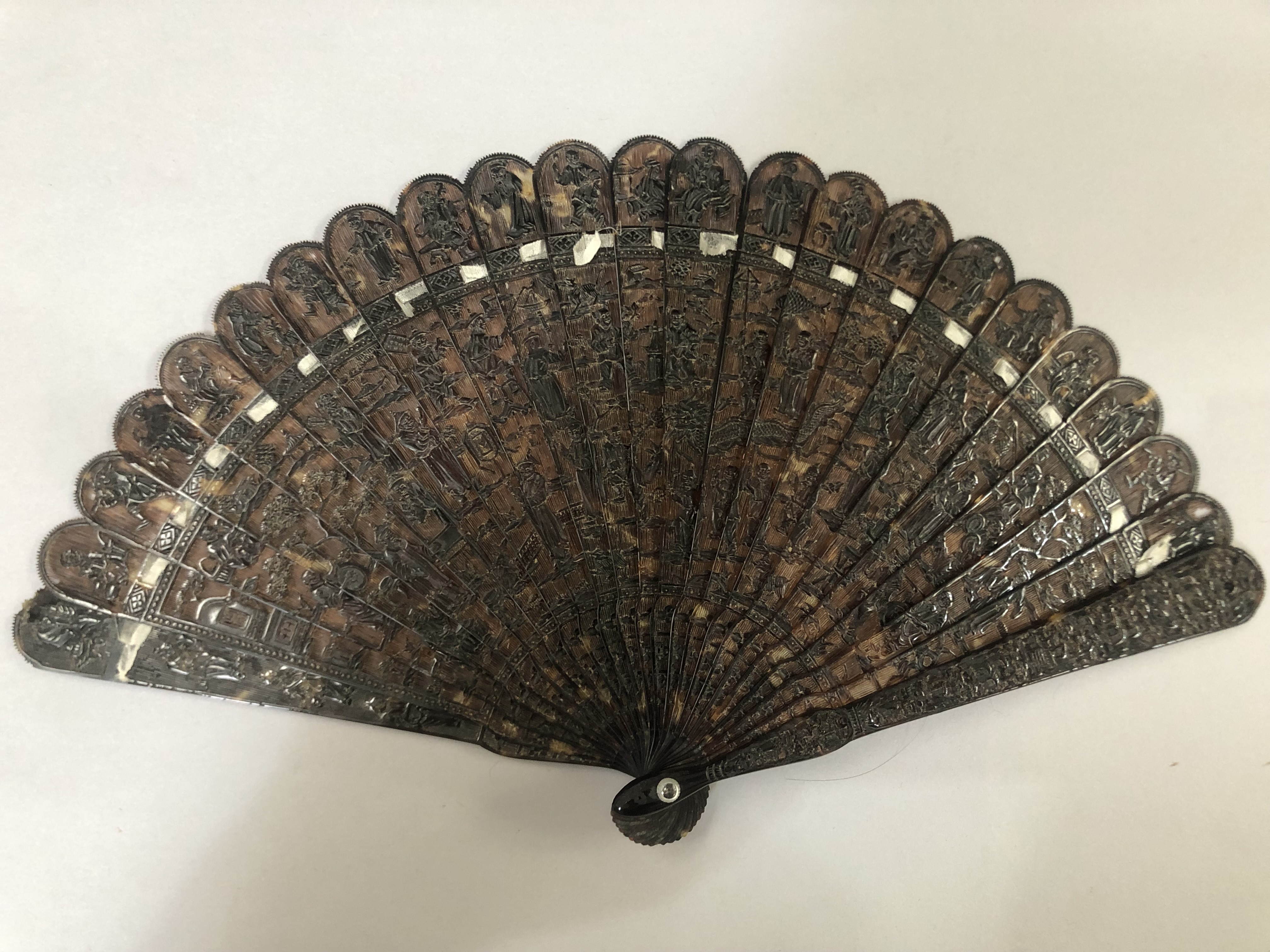 C 1840’s a Chinese carved tortoiseshell brisé fan, with original box stamped with the name TugShing,