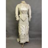 A classic 1880’s wedding two piece, the long -line tailored bodice in fine cream wool with silk