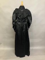 C 1895/1900, a two piece black silk satin skirt and boned bodice bearing the attribution, in gold on