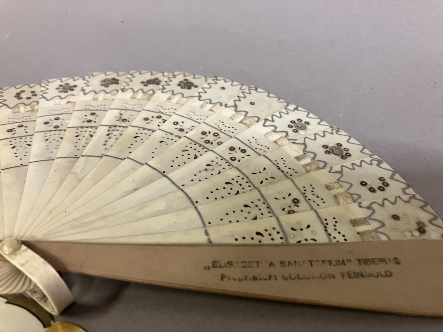A selection of small brisé fans: a brisé fan advertising Victoria Luise, a shield on the lower guard - Image 3 of 4