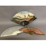 A Regency engraved and coloured fan with double paper leaf, and slender wood monture with bone thumb