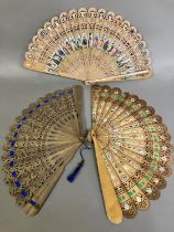 A wood brisé fan of the type produced in Austria and then applied with scraps, in ascending size,