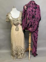 An Edwardian evening dress in dark cream chiffon, with short sleeves and scoop neck, lined in