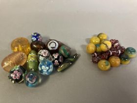 Trade beads: a selection of glass beads, many with floral patterns, to include 10 in a deep