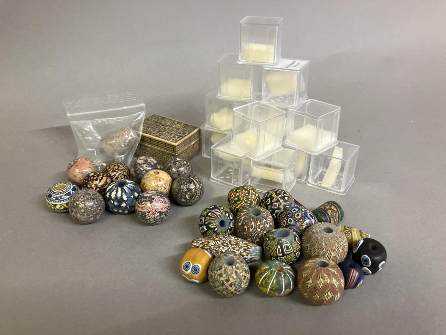 Trade beads: a selection of mainly round beads, some matt, some shiny, all with intricate