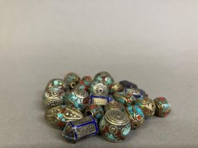 Trade beads: a selection of small beads with metal inlay, four similar in royal blue, the