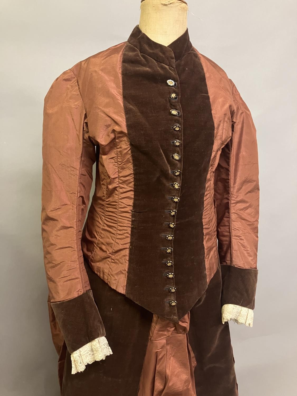 A c 1880’s century two piece costume, mid-brown silk and darker velvet, the bodice with straight - Image 2 of 6