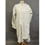 A mid-19th century gentleman’s nightshirt, French, exceptionally long, heavy linen, with a short,