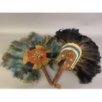 A North American Indian feather fixed fan, 19th century, applied with a small bird, the shaped