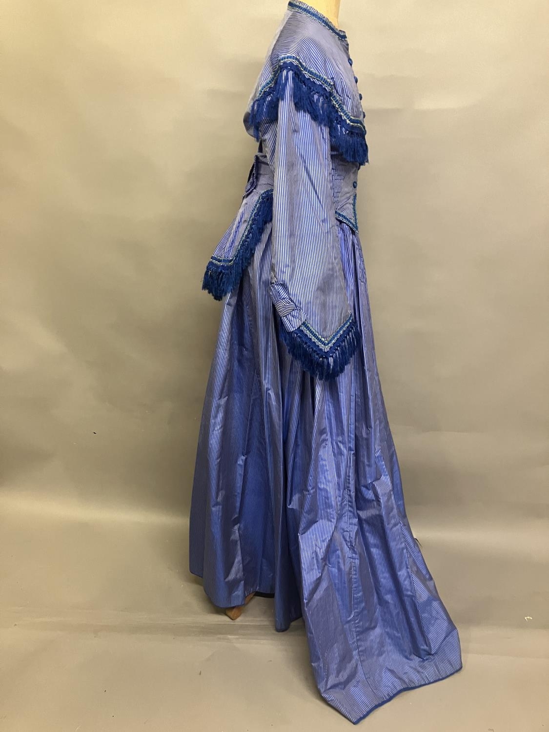 C 1865, a striped blue silk two-piece ensemble, short bodice with rear detail, trimmed with - Image 3 of 8