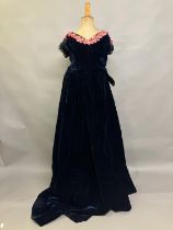 A mid-19th century two-piece velvet evening ensemble, very dark navy, full, trained skirt, the