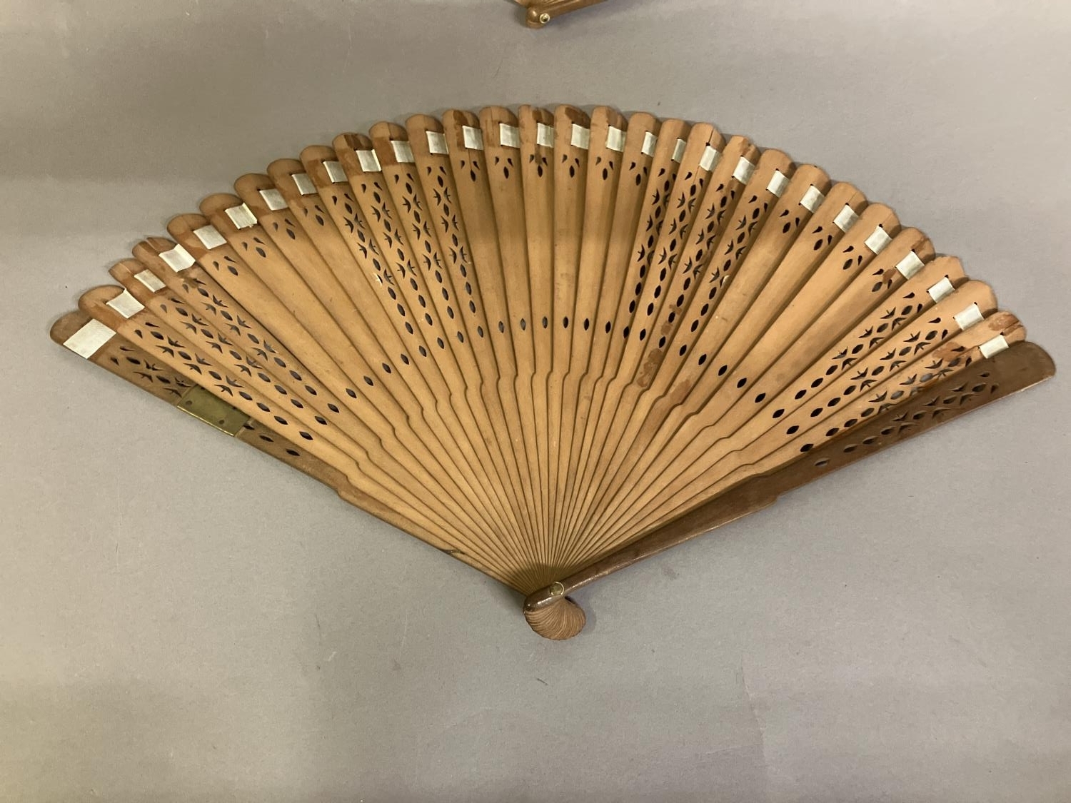 Two late 18th century wood fans, the first a brisé with rounded tips, pierced, with applied - Image 6 of 7