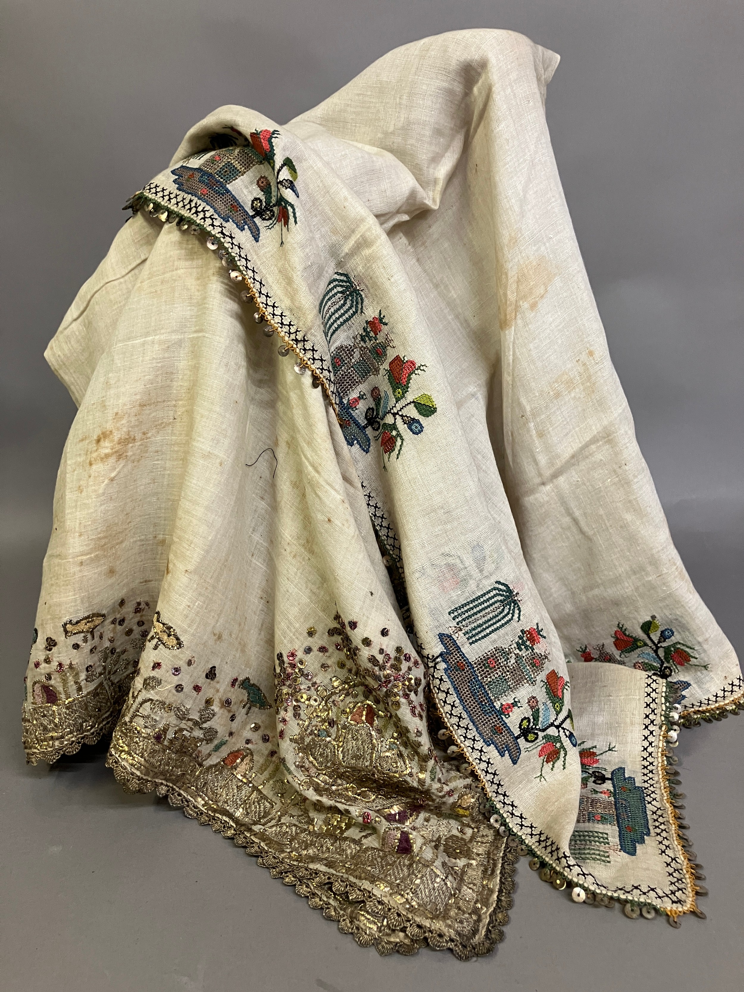 Two 19th century turban covers or wraps, bocha, square, the first of fine linen and very heavily