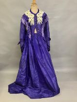 A bold purple silk taffeta two-piece c 1865 -70, the boned bodice with bell sleeves, embossed