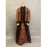 A c 1880’s century two piece costume, mid-brown silk and darker velvet, the bodice with straight