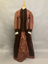 A c 1880’s century two piece costume, mid-brown silk and darker velvet, the bodice with straight