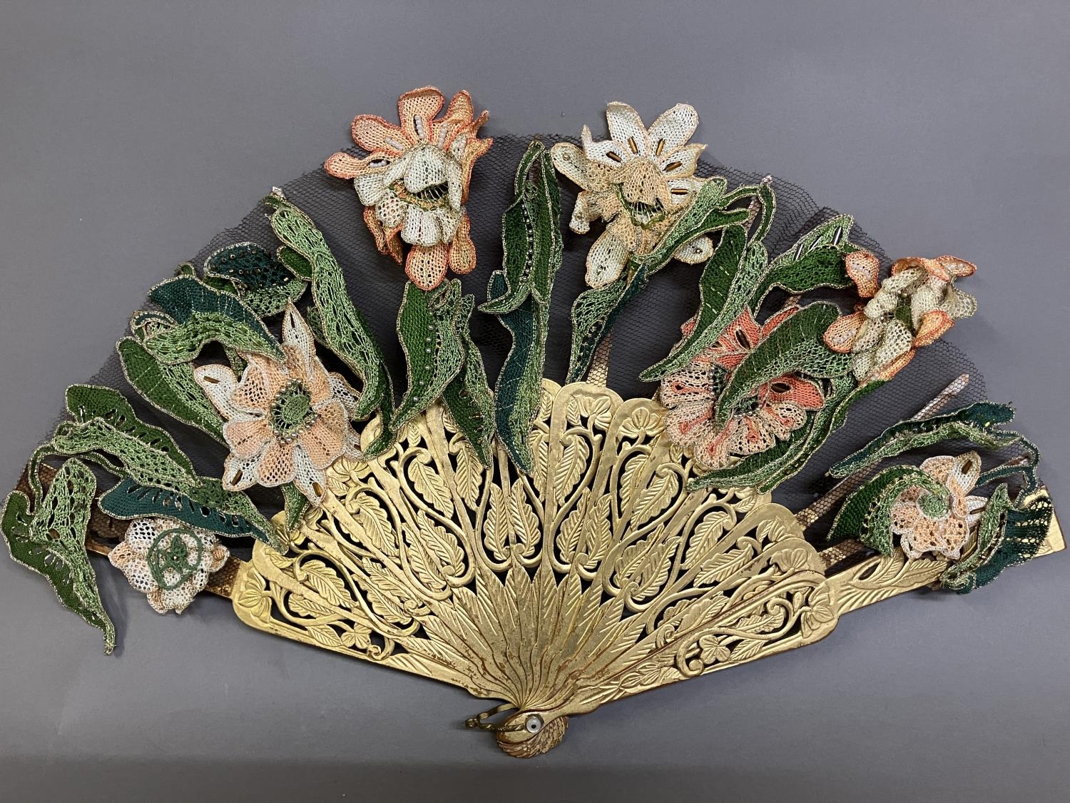 Ann Collier: An intricate leaf designed to form a posy when closed, the monture of wood, carved