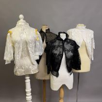 Edwardian style blouses: four blouses, two black, two cream, all with high necks, different styles