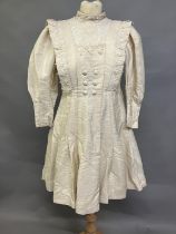 An early 20th century dress for a young girl, cream glazed cotton (?) with chemical lace trimming,