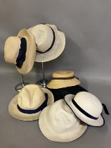 Early 20th century straw hats, French, unused, still labelled, various colours, mostly with