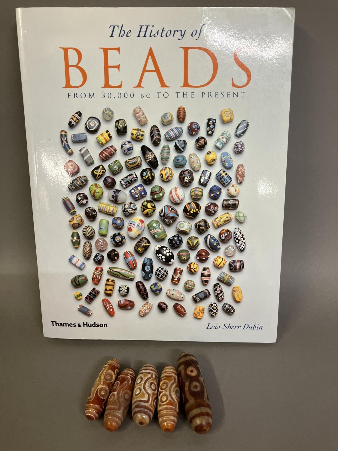 Trade beads: Six large beads with eyes, four very similar with the work in relief and defined ridges