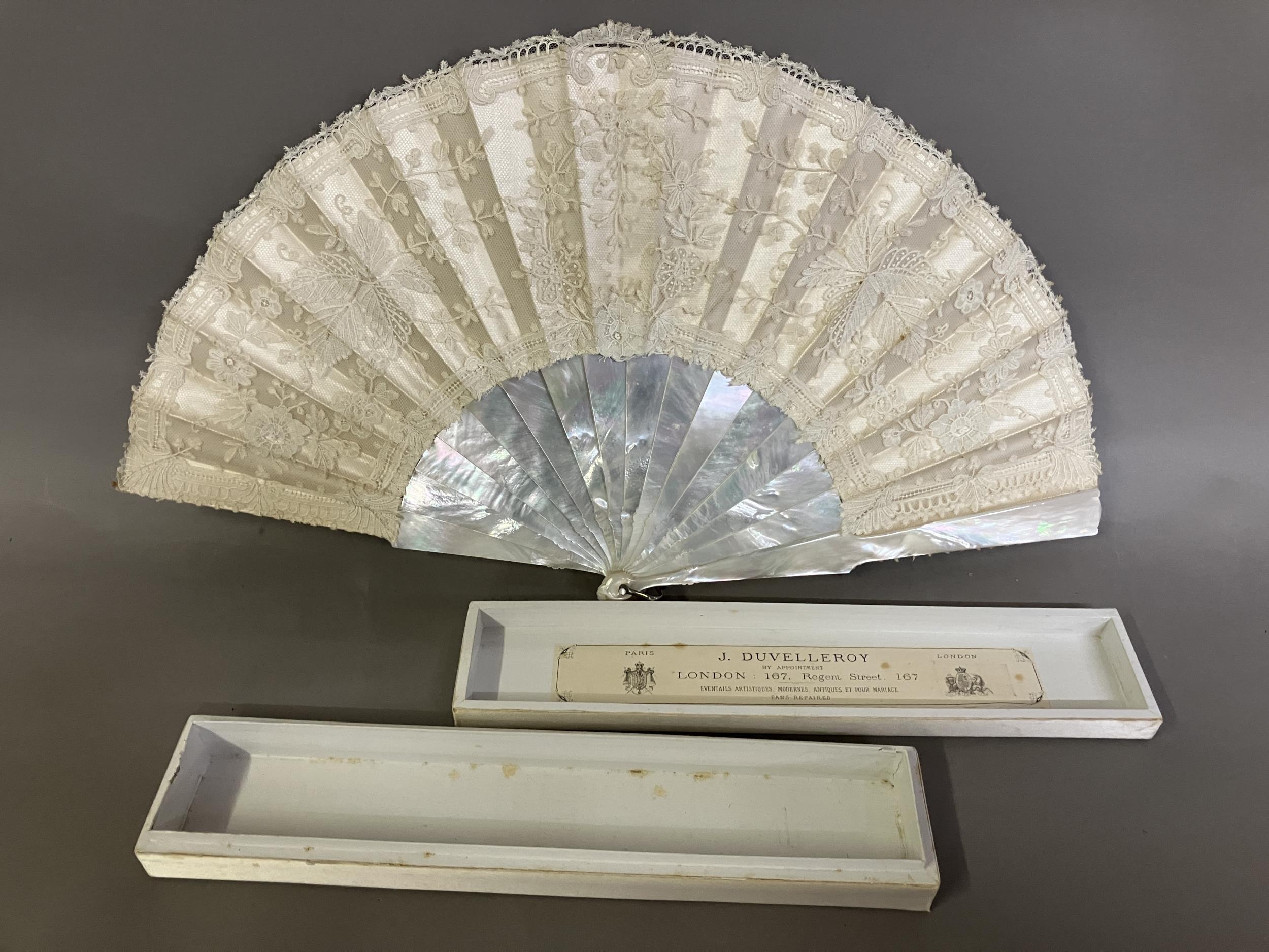 A 19th century Brussels Bobbin Appliqué lace fan, the monture of white mother of pearl, the head