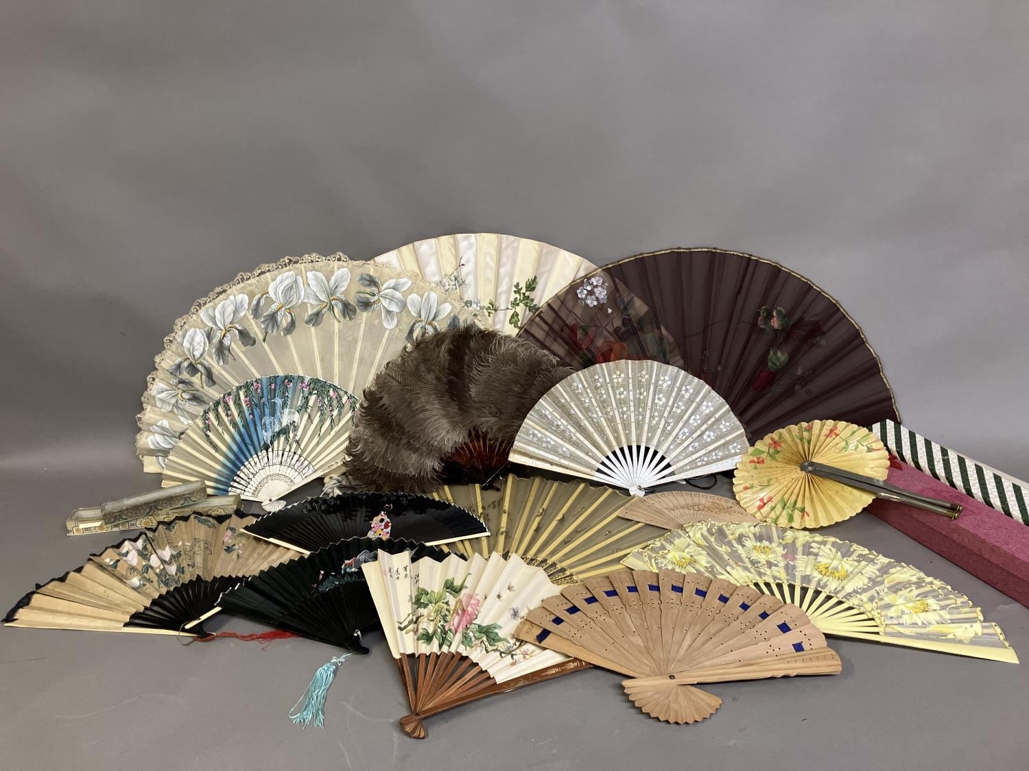 Five c 1890’s fans plus an assortment of tourist and other fans: a large bone fan, the leaf a good