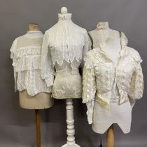 Edwardian style blouses: four cream or white blouses, all with high necks, different styles of