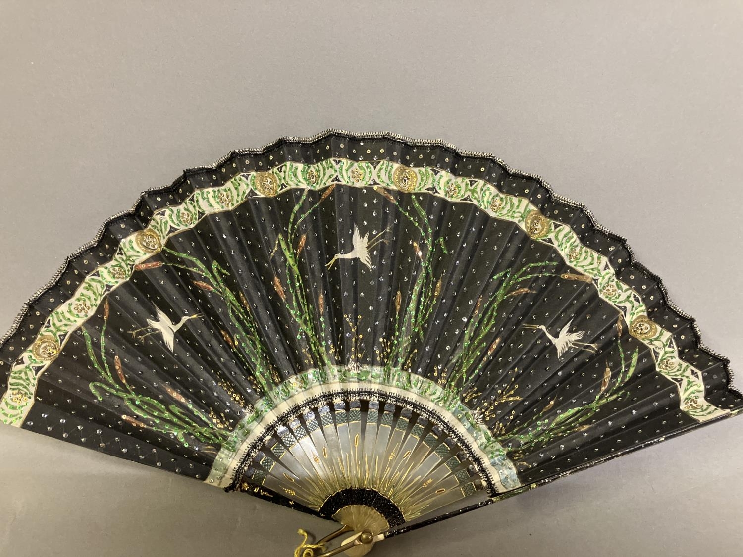 An Art Nouveau fan, the monture of bone, shaped and gilded, the silk leaf painted with a lady in a - Image 10 of 10