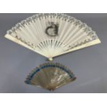 C 1890’s, an unusual incised bone fan mounted with a leaf of cream silk, bordered with a floral