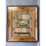 A mid-19th century darning sampler, European, unusual with a mix of darning, woolwork, beadwork,