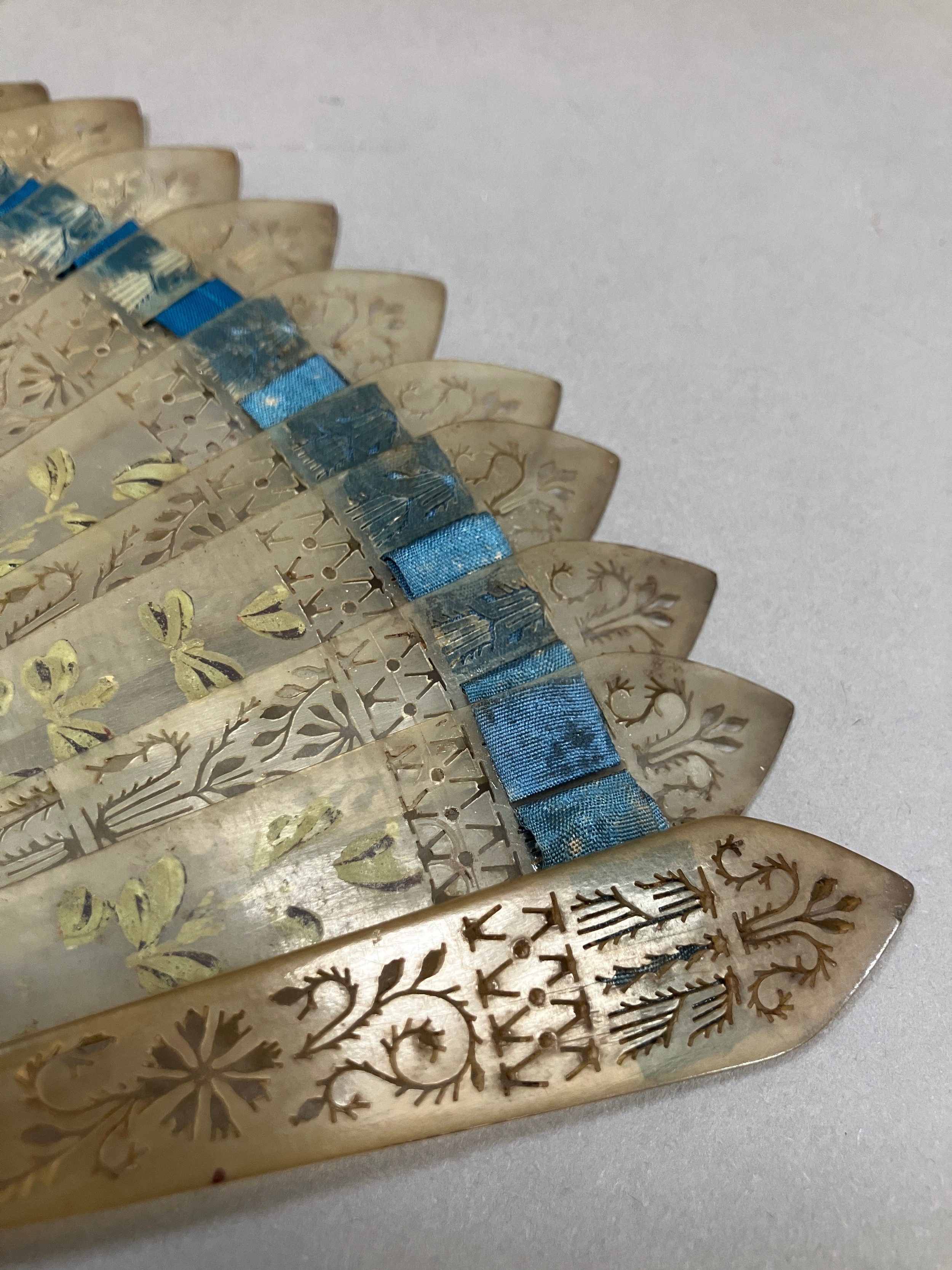 C 1890’s, an unusual incised bone fan mounted with a leaf of cream silk, bordered with a floral - Image 7 of 9