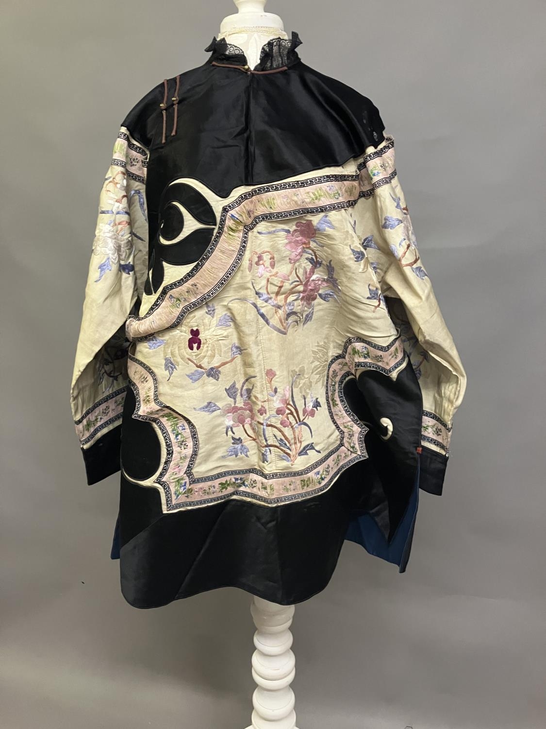 An antique Chinese embroidered silk jacket, Ru, closure to the right, with 5 metal bobble buttons,