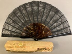 A 19th century tortoiseshell fan mounted with a black Chantilly bobbin lace leaf, the design of