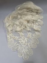 Antique Lace: a fine triangular shawl in Honiton bobbin lace appliqué, the corners featuring large