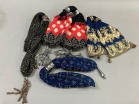 Four large, 19th century miser’s purses, the first crocheted in navy blue with the addition of cream