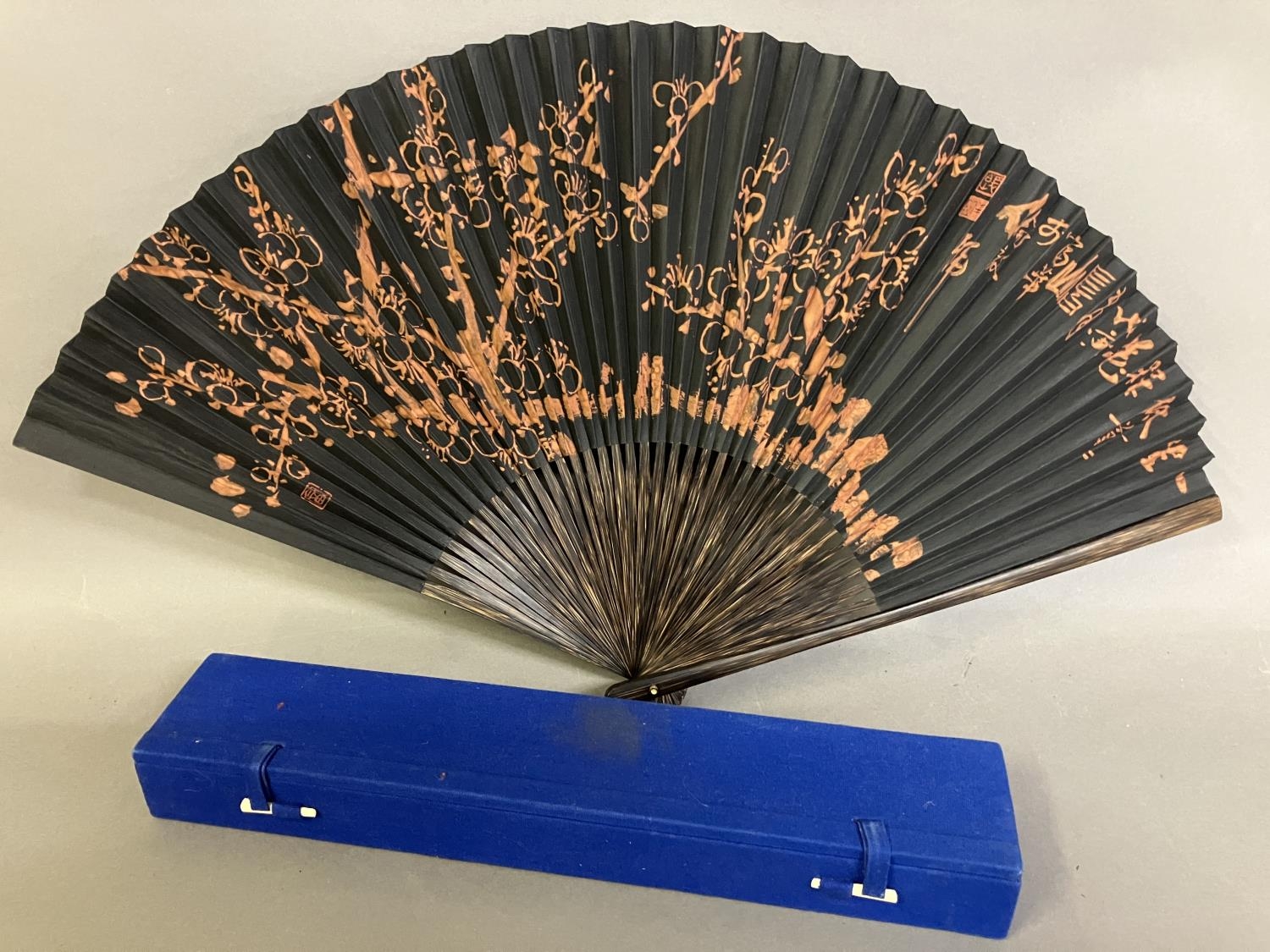 An original fan by Chinese Master Artist Fu Hua, 20th century, the recto painted with flowering
