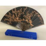 An original fan by Chinese Master Artist Fu Hua, 20th century, the recto painted with flowering