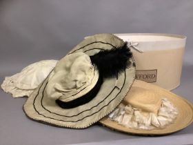 Three stylish Edwardian hats, large, the first in cream cotton, the brim wired, pleated and frilled,