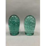 Two Victorian green glass dumps having air bubble inclusions, largest example 15cm high