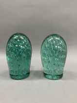Two Victorian green glass dumps having air bubble inclusions, largest example 15cm high