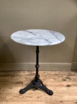 A Victorian style cast iron and marble garden table