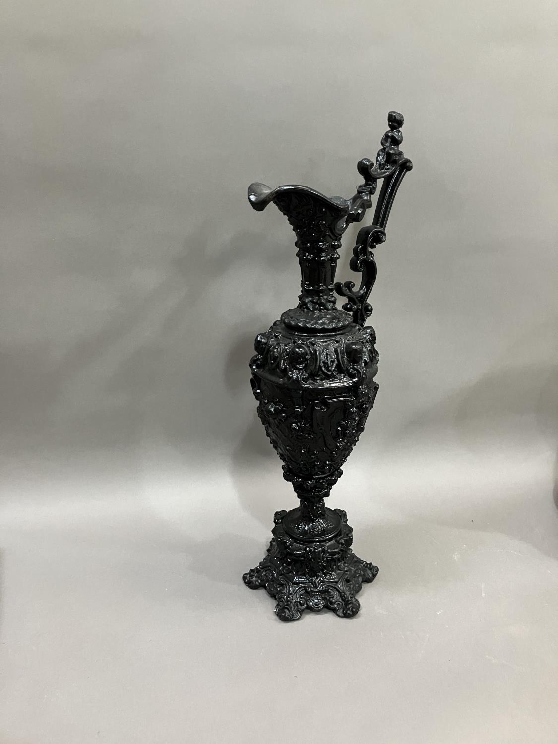A French black cast metal and heavily moulded ewer, the handle surmounted by cherub, 45cm high - Image 2 of 5