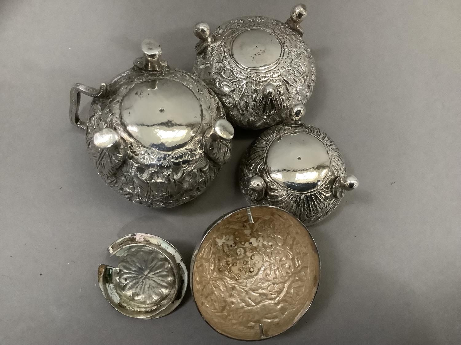 An Indian three piece cruet in white metal (tests as silver) comprising mustard pot, open salt and - Image 4 of 4