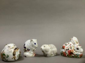 Four Royal Crown Derby paperweights including a dormouse, harvest mouse, a vole and a rabbit, all