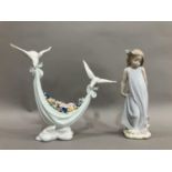 A Lladro figure group of two doves carrying a swag of flowers, no.6579 and Girl with butterflies