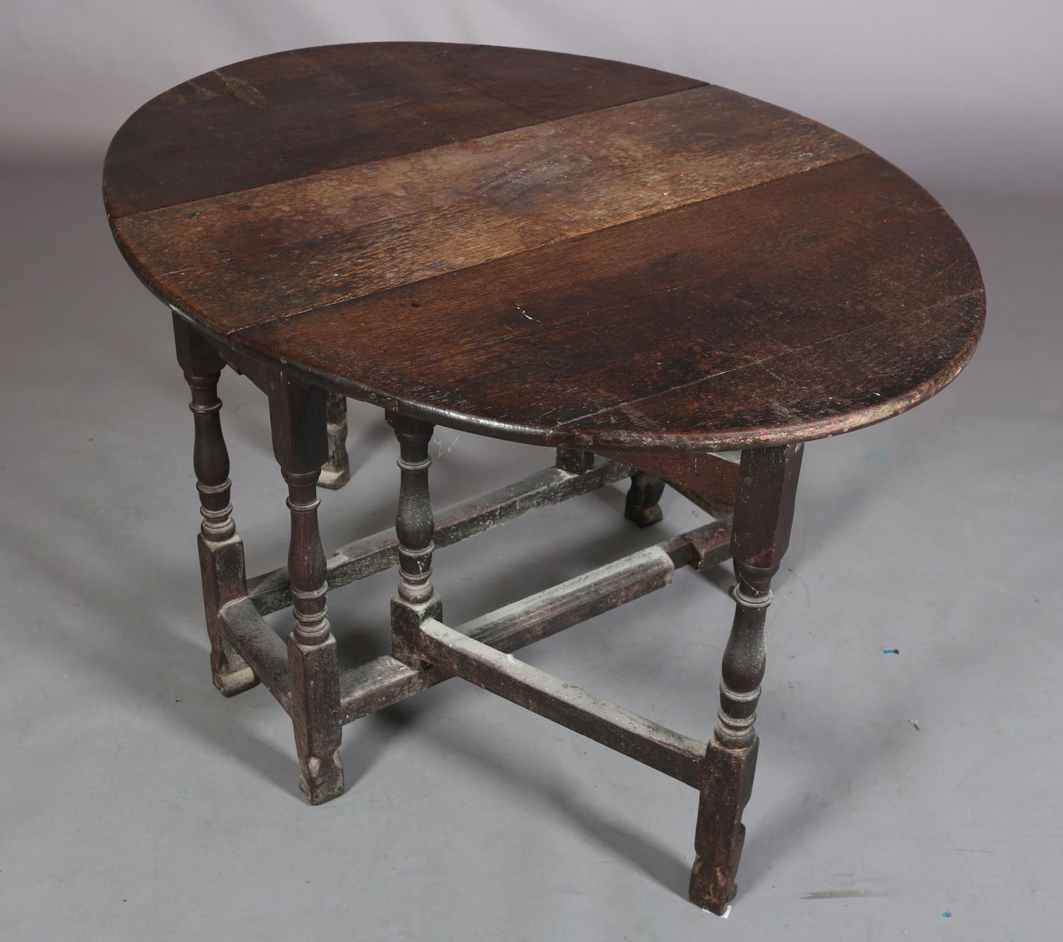An 18th century oak gateleg supper table having twin oval drop leaves on baluster turned and - Image 4 of 4