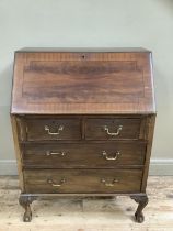 A mahogany cross banded bureau, fall front over two long, two short drawers, 77cm wide