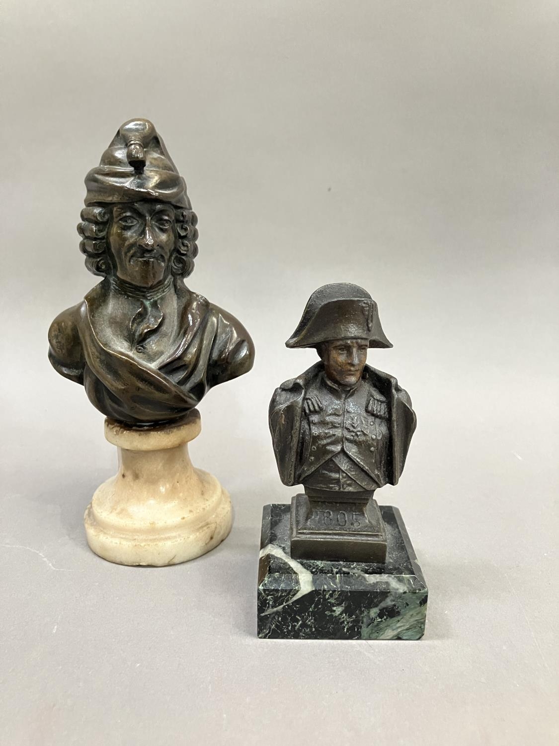 A bronze bust of Voltaire on a swept marble base, 15cm high together with a metal bust bust of