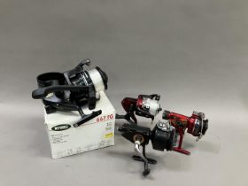 A Mitchell 667 FG reel with spare spool, boxed together with a Crane CS400FD reel and a